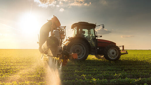 Tractor spraying pesticides