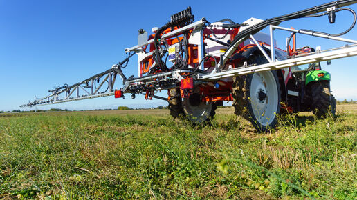 red tractor sprayer in the field